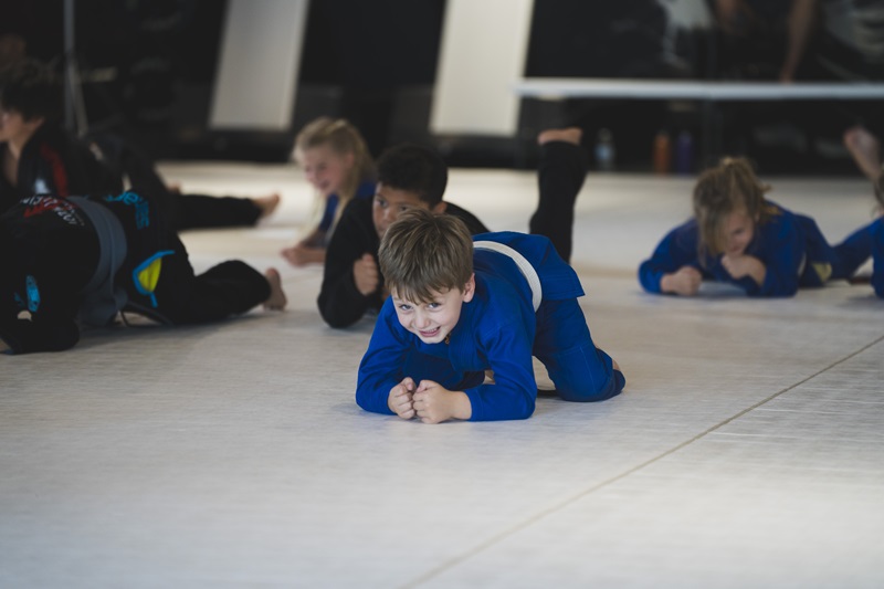 Children Kneeling On The Floor For Training